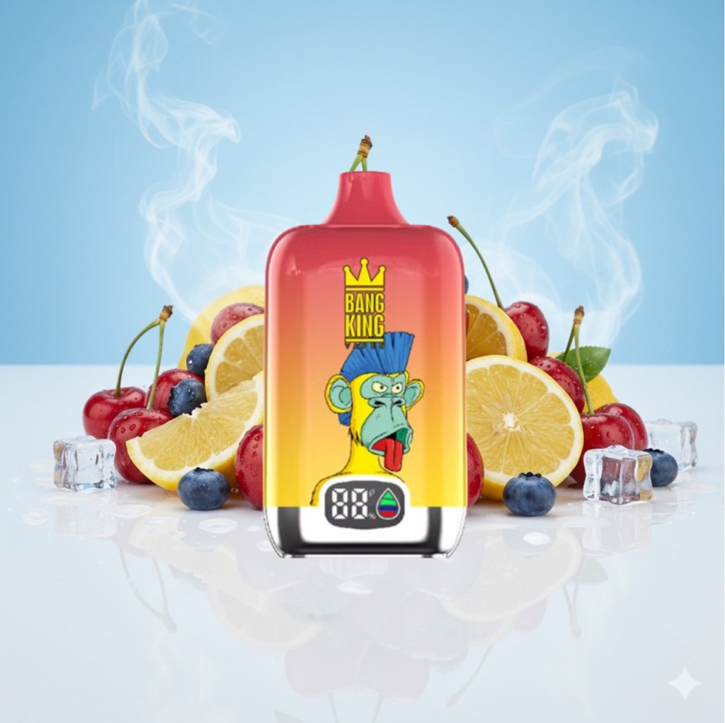 A colorful vape bottle with a cartoon monkey design, labeled 'BANG KING', surrounded by various fruits like lemons, cherries, and blueberries, with ice cubes and smoke in the background.